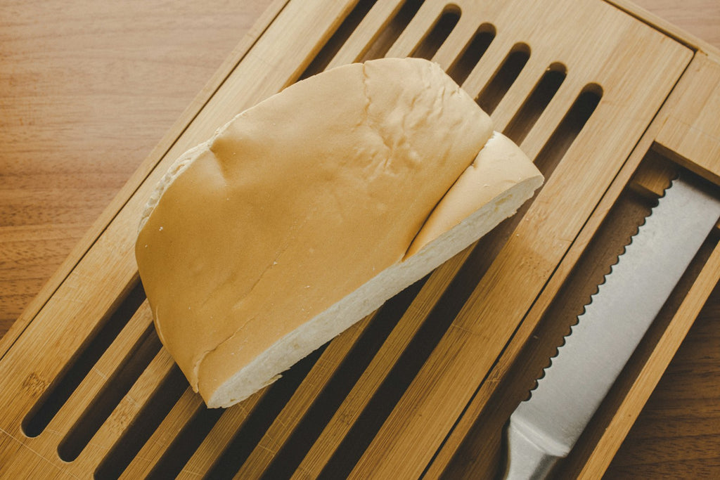 Bamboo cutting board in kitchen setting